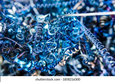 Metal offcuts. rusty swarf debris, waste pieces from turning process of metal working with lathe machine, rusty string structure, material recycling, manufacture process waste, industrial background, 