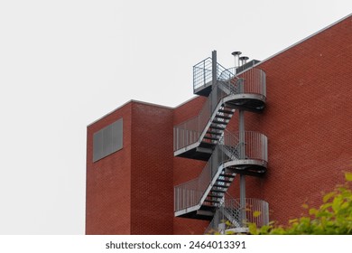 Metal outdoor stairs, industrial stairs, fire escape stairs, metal stair structure, made of stainless steel, stairs leading to building corridors

 - Powered by Shutterstock