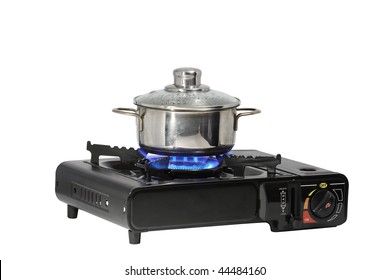 Metal Pan Standing On Modern Portable Gas Range With Flame. Isolated On White Background With Clipping Path