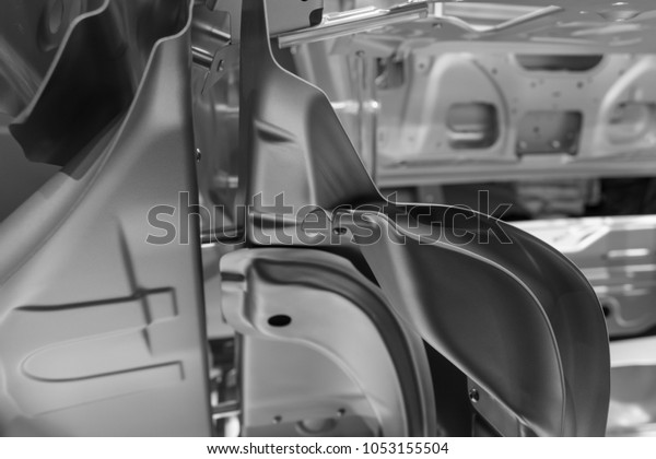 Metal parts of
a car in automotive production
.