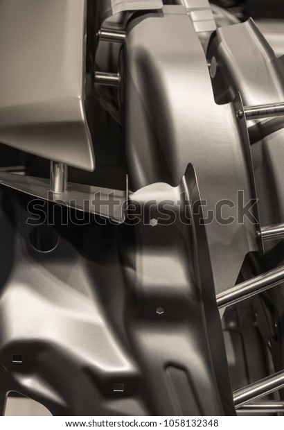 Metal parts of\
a car in automotive production\
.