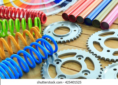 metal parts coated with powder coating on wooden background.