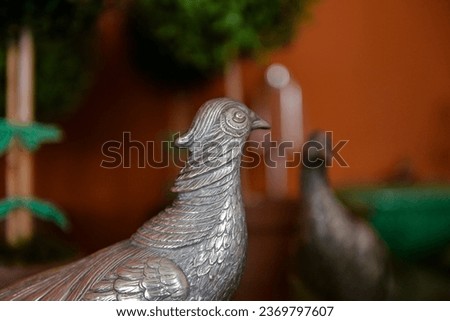 metal pheasant, bird in a cage, close up of a bird, silver bird, portuguese silver, interior decoration, decorative birds, bird sculpture, blurred background, country decor, vintage decor
