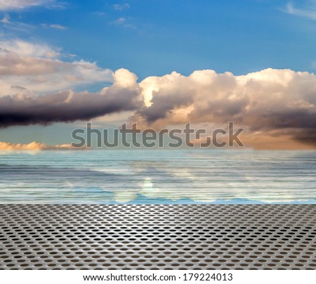 wooden platform with blue posts with ropes and orange lifebuoys on the background of the sea and sky with clouds Egypt Dahab South Sinai