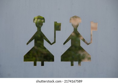 Metal Plate With A Cutout Of The Silhouette Of Two Persons In The Style Of The Traditional Presidential Guard In Athens, Greece. Local Style Art. 