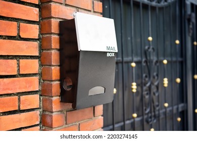 Metal Post Box On Brick Wall And White Address Plaque, Selective Focus