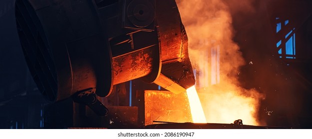 Metal pouring with sparks. Smelting of cast iron parts in foundry. Metallurgical plant or Steel Mill - Shutterstock ID 2086190947