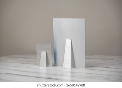 Metal Print Photography Product With Kickstand - Back View. Shot On Isolated White And Gray Background With Blank Empty Room Space For Text Or Copy.