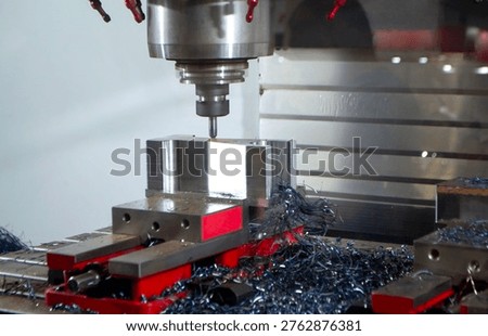 Metal processing machine. Machining center. CNC vertical machining center. Computer control. Metal milling equipment. Metal shavings. Machines production tools Industrial
