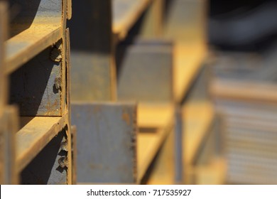 Metal profile beam in packs at the warehouse of metal products, Russia - Shutterstock ID 717535927