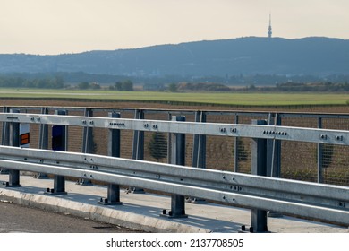 Metal Railing By The Road. Close Up Photo.