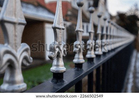 Metal railings topped with silver finials