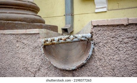 Metal Rain Drain At The Base Of The Building.Very Soft Focus