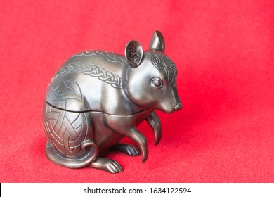 A Metal Rat On Bright Red Fabric, Close Up View. Celebration Of The Chinese Horoscope 2020, Year Of The Rat Concept.