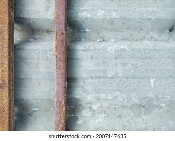 Metal Roof  A Lot Of Red Steel Beams Are Being Eaten By Rust, Giving The Concept Of Deterioration, Corrosion.