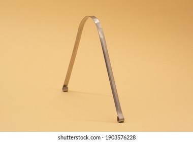 Metal Scraper Or Tongue Cleaning Brush. Hygiene Of The Oral Cavity