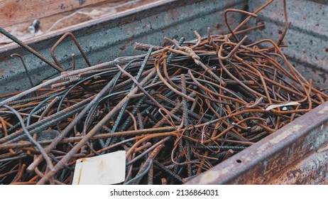 Metal Scraps from Construction Site Rebar Rods Stored in Waste Container - Shutterstock ID 2136864031