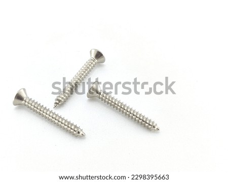 Metal screws on white background.