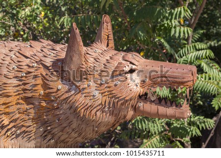 Metal sculpture of wolf made of details of old cars