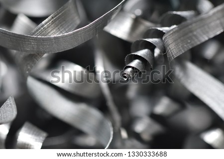 A lot of metal shavings close-up, after working on a milling machine or CNC machine. Texture metal shavings macro