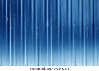 Metal sheet fence texture in navy blue color. Architectural and construction background