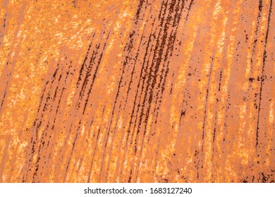 Metal Sheet With Old Cracked Paint. Streaks Of Strong Rust. Primary Colors - Peru Tan, Porsche, Almond.