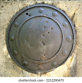Metal shield pierced as emblem of ancient war vestige - Shutterstock ID 2212290475