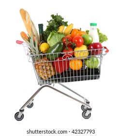 metal shopping trolley filled with products isolated on white