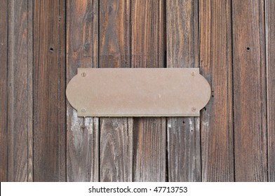 Metal Sign On Wood Plank Background