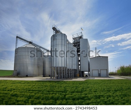 metal silos for storage, grain elevator complex for receiving, cleaning, drying and long-term storage, norias for lifting grain and a working tower
