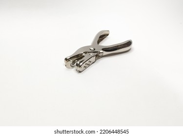 Metal Single Hole Punch, Shot On A White Paper Background.