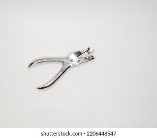 Metal Single Hole Punch, Shot On A White Paper Background.