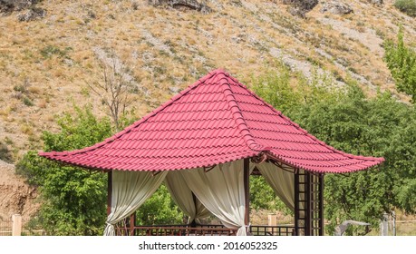 Metal Slate Gazebo Roof Close-up.Roof From A Metal Profile Against The Background Of Mountains