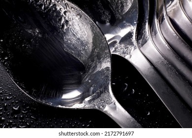 metal spoon with water drops on dark background  - Powered by Shutterstock