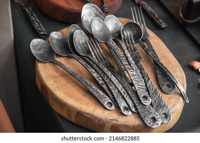 Metal Spoons And Handmade Forks Wrought By Blacksmith At The Fair, Medieval Utensils In Modern Times