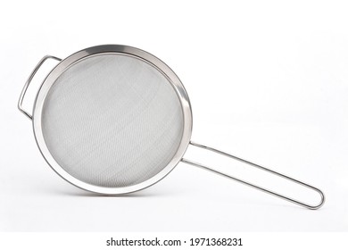 Metal or stainless-steel kitchen strainer, kitchen tool, isolated on white background with space for text