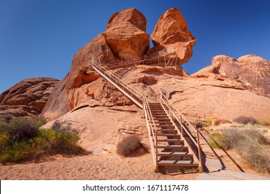 Metal staircase leading to Atlatl Rock with 4000 years old Petroglyphs from Native Americans, in Valley of Fire State Park, Nevada, USA