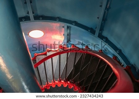 Metal stairs inside the lighthouse. Cosmetic repair of the lighthouse, Estonian island of Kihnu.