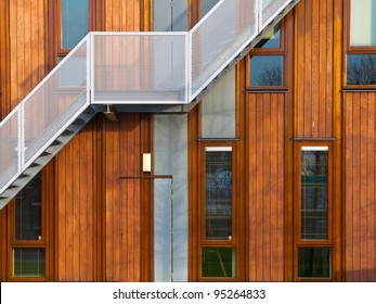 Metal stairs on a modern wooden facade - Powered by Shutterstock