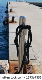 Metal Stake At The Entrance Of A Pier