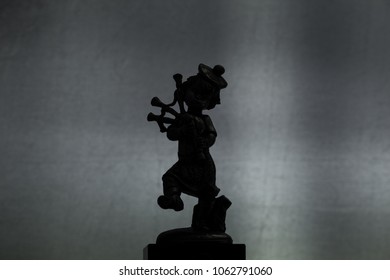 Metal Statue Of A Bagpipe Player Silhouette