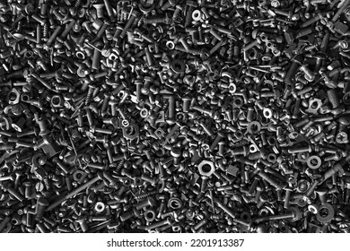 Metal steel gray bolts, nuts, screws and screws are lying on the floor. Fasteners and hardware for repair - Shutterstock ID 2201913387