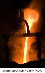 Metal Steel Molten Pouring Mill Molten Iron Flowing From The Smelter Pot Metal Steel Molten Pouring Mill Explode Plant Interior Flow Explosion Industry Black Abstract Equipment Yellow Hook Manufacturi