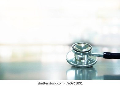 Metal Stethoscope For Medical Healthcare Checkup Reflection On Laboratory Table Background  