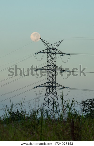 metal\
structure at the fieldworker, full moon\
back