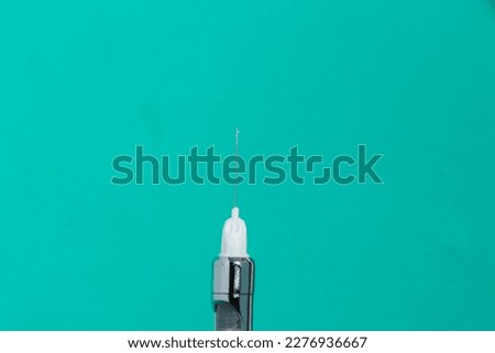 Similar – Medical syringe on colorful background.