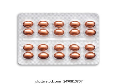 Metal tablet blister. Golden orange pills medicine. Silver shiny blister with drugs. Capsules in blister pack closeup. Brown medicament texture. Aluminum pills blister isolated on white.