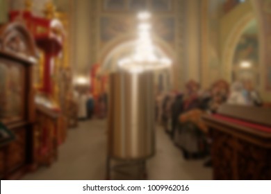 Metal tanks of stainless steel with water installed in the church during the night service at the Epiphany. Specially defocused image with blurred image - Shutterstock ID 1009962016