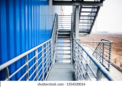 Metal technical steps on the building
