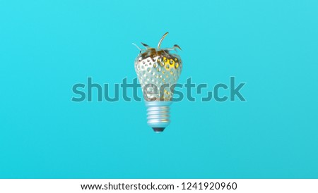 Metal textured strawberry lightbulb idea on blue background. Minimal idea concept. Trendy pastel colors.